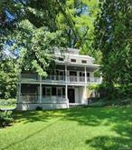 Turn back the hands of time with this beautiful home built in 1798 reminiscent of the deep south! It&rsquo;s 3 stories, two of which have gorgeous wrap around newly redone porches, that you can envision with rocking chairs, sipping mint juleps or enjoying a summer meal. The 3-story farmhouse has a newly refurbished kitchen, two living rooms, 3 bedrooms, two and a half bathrooms, a cozy fireplace and hardwood floors that add to its eloquence. All of this is situated on an acre of land with .46 of an acre across the road that has a babbling brook running through it. On the back of the property sits a 2-story renovated barn, perfect for an art studio or whatever your mind imagines with plenty of storage below. More than 90% of the property is newly fenced in perfect for dogs to run! There is also a back shed for mowers and such, a corn crib which is a rare find in Dutchess County these days, and a large tool shed off the patio next to the main house for storage or a he/she shed. A large portion of the lawn is flat, with outside electricity, perfect for tent parties, a gazebo or pool! This house and land are rich in local history and was a part of a large working farm back in the day known to the locals as Woodinville. Bring your imagination and dreams and come see this beautiful, rare & unique home! OWNER MOTIVATED! Additional Information: Amenities: Guest Quarters, Heating Fuel: Oil Above Ground,