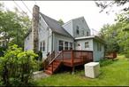 This spacious 2-acre private multifamily property offers a wealth of features and incredible potential. The downstairs living area features a charming fireplace and elegant hardwood floors with a full kitchen. The heating system runs on oil (above ground). The roof is estimated to be 10-13 years old, with one of the furnaces being just 3-4 years old. Additionally, the generator is approximately 10 years old. The upstairs has 3 bedrooms with a bath and full kitchen. Each floor has a propane tank for the stoves. This property would be great for an investor or potentially a large family. Close to highway, shops, Bethel Woods, Resort Worlds, Legoland, state land for hiking and wineries.Accepted offer