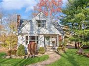 A rare find! Charming four bedroom, two full bath Cape Cod style home at the foot of Mount Beacon. Follow the brick walkway, with a natural stone border surrounding boxwoods, burning bush and rhododendrons, to the welcoming front porch. First floor boasts an open concept floor plan, with a spacious and sun-filled living room with two sitting areas; one by the front bay window with mountain views, and the other in front of the wood-burning fireplace, with classic mantel and tile surround. Dining area, surrounded by large windows, leads to screened in porch, perfect for lounging, dining, sunsets, and enjoying nature all year long. Updated kitchen with new Kitchen Aid stainless steel appliances, farm sink, and plenty of cabinets and counter space for prep. First floor bedroom ideal for guests, or home office, and full bathroom with walk-in shower. Second floor primary bedroom with walk in closet. Renovated full bathroom with soaking tub, beautiful tile surround with niche, and marble floor with herringbone pattern. Two additional bedrooms with beautiful views and plenty of closet space. Heated and dry basement with laundry, storage, separate workshop space, and garage with new door. Gleaming hardwood floors, custom recessed lighting, three zone heating, and wooden Anderson windows throughout the home. This home is surrounded by beautiful trees, with hiking trails right outside your door, yet close to Beaconâ€™s Main Street, DIA:Beacon, the Hudson River and Metro North for easy access to New York City. Beautiful home!