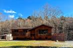 If peace and tranquility are what you&rsquo;re looking for than look no further than the Catskill Mountains and this gem of a home in the sleepy town of Grahamsville. This raised ranch has three spacious bedrooms on the main floor, a generous living room with original wood features, hardwood floors, and large picture windows, rear deck overlooking the rolling hills and a peaceful stream in your own backyard that is accessed from your formal dining room. The walkout finished basement includes hardwood floors, panel ceiling, and a full bathroom with pedestal sink and ceramic standing shower. Additionally, the finished basement includes two bonus rooms and large utility room with washer/dryer hookups and a sliding glass door to the backyard. The low taxes, quiet neighborhood, and beauty of nature makes it the perfect place to call home.