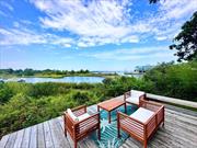 Looking for both waterfront and a unique home. Welcome to Quaint in Quogue, located in a premier private bayfront community, this 3 story lighthouse style home with detached double garage was built in 1957 and has breathtaking views of Shinnecock Bay plus the peace and quiet you need to unwind. The main floor offers a bedroom, an office area, living room with fireplace, living area with sweeping views of the bay, kitchen, full bath, stackable washer and dryer & large family room with pull-out sofa bed. The second floor offers the main suite with the most stunning views, walk in closet and full bath. The third level is the charm! A most spectacular finished space surrounded by windows boasting stunning views past Ponquogue bridge. Step outside on the wrap-around deck and enjoy the cool breeze and views. This unique property also offers a lower level deck to enjoy early morning coffee or late afternoon BBQs. There are approved plans to upgrade the existing property. The large double garage allows for the possibilities to convert to additional living space with planning approval required. There is a private community beach 2 short blocks away.