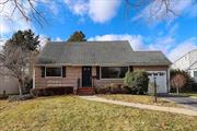 Welcome to this charming Cape-style home located in the coveted Radcliff Manor section of East Norwich. This home offers a perfect blend of comfort and charm.The main level features a spacious living room, a versatile dining room that can be converted into a bedroom, a partially updated full bathroom and a bedroom. Completing the lower level is an eat-in kitchen that includes stainless steel appliances and a sliding door to the backyard. Upstairs, you will find a large primary bedroom, a second generously sized bedroom, and an updated full bathroom. Hardwood floors are present throughout the home, adding to the overall flow and continuity. Modern updates include new windows and doors, along with a new hot water heater. The full unfinished basement provides ample storage space and offers potential for additional living or recreational areas. The exterior features an oversized deck that leads to a large backyard, offering plenty of room for outdoor activities or entertaining. Conveniently located near local restaurants, markets, shops, and services, this home is just a 5-minute drive to the historic town of Oyster Bay, offering access to beaches, dining, shopping, and wellness centers. Public transportation and golf courses are also nearby. This home is a great opportunity to enjoy all that East Norwich and the North Shore of Long Island have to offer.