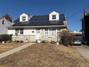 Lovely 7 room wide line cape. Walking distance to schools, shopping, transportation, park. Solar Electric Powered.