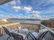 A home for all seasons! Perched above the Hudson River with breathtaking views of the Hudson Valley and Bannerman Castle, this impeccably designed 3-bedroom, 3.5-bathroom townhouse redefines luxury living. Spanning 3, 102 square feet with over 800 square feet of deck space across three levels, this home boasts abundant upgrades and amenities. Enter this home through the oversized grand foyer into the sunlit main living floor showcasing a wall of windows framing your stunning view as well as a chefâ€™s kitchen with granite countertops and ample cabinetry. The primary suite features a spa-like ensuite bath with a hot tub, a walk-in closet, and a private terrace to soak in the spectacular scenery. A guest bedroom also offers the convenience of an ensuite bath. The versatile downstairs level offers additional living or entertainment space, perfect for an in-law suite conversion. An oversized garage provides indoor parking and extensive storage options. Residents enjoy a wealth of community amenities, including a pool with lifeguards, a fitness center, tennis and pickleball courts, a basketball court, and a clubhouse with a kitchen for hosting gatherings. Close to all the best that New Windsor and Newburgh have to offer, and the free ferry to and from the Beacon Metro North Station for direct access to Manhattan! One of the largest units in the community, not to be overlooked! *All information contained herein deemed reliable but should be independently verified.*