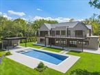 Just completed, an exciting new luxury residence by BJC Custom Homes. Secluded on 2 acres in North Haven Point on the banks of serene Ganet Creek. Truly among nature and just minutes to Sag Harbor Village. Enjoy all the area has to offer: private beach, 3 pristine championship tennis courts and basketball. Designed and crafted to perfection by master builder Matt Pantofel. 9, 692 sf of luxury living on three levels with elevator, high-end finish, linear lighting, custom cabinetry, and a keen attention to detail throughout. 8 bedrooms, 10 full bathrooms, and 3 half baths. This sleek open floor plan boasts a sun-filled reception and open floor plan that seamlessly flows through the gallery into the living space. Great room w/ showcase wet bar and White Oak linear gas FP. Sophisticated custom eat-in Chefs kitchen, fully outfitted with high-end appliances, custom cabinetry, oversized island and walk-in prep-pantry. Pass-through Butler&rsquo;s leads to the formal dining room featuring an expansive custom wine closet. The first floor also features an intimate family room/den, spacious junior primary suite, paneled home office, formal powder room, and mudroom with an additional half bath and laundry adjacent to the 2 car heated garage. The second story grand primary suite encompasses the east wing featuring a gracious sleeping chamber w/ gas FP, a large balcony, and two custom WIC fully outfitted with built-in shelving. The spa bath is adorned with exquisite finish and includes a freestanding soaking tub, personal vanities, spa shower, and WC. The second level also features an open upstairs living room, w/ gas FP and recessed linear lighting. 4 additional spacious guest suites and 4 machine laundry complete. Descend to the lower level boasting the full program. A grand 3, 200 sf. Expansive recreation and media space with linear gas FP and entertainment wet bar. Large gym w/ wellness center featuring steam and sauna. Home Cinema. A powder room and 2 additional en suite guest rooms complete. Outback a resort-style oversized heated Gunite pool and spa, open pool cabana w/ wet bar and FP, built-in BBQ, outdoor shower and full pool-cabana bath. Seamless indoor/outdoor living amongst nature&rsquo;s backdrop. 5 Widow Cooper&rsquo;s Path, North Haven Point, Sag Harbor.