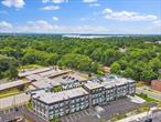 Immediate occupancy available in The Rose at Great Neck. 40-New Luxury Condominiums on the North Shore of Long Island. This brand new mid-rise building is now over 30% sold. Offering an unparalleled residential experience and amenities including virtual doorman services, welcome lobby, resident lounge with YouTube TV, plus gym fitness center with treadmill, bike and free weights. Retreat to the rooftop common area and hang out at the perfect place to unwind with seating and enjoy the outdoors that include distant views towards New York City. Private indoor garage parking and outside private lot parking. The earliest residents have preferred choice of parking spaces. The allure of The Rose extends beyond its walls as residents enjoy instant access to the Village of Great Neck Estates Waterfront Park featuring Olympic sized swimming pool plus small pool, 7 tennis courts plus indoor tennis court in a bubble, marina and dock area, direct waterfront esplanade with views of Little Neck Bay, Douglas Manor and the Throgs Neck Bridge, shoreline access, baseball and soccer fields, playground, basketball, pickle ball, handball courts and snack bar. The Rose was creatively designed by famed architects Mojo Stumer with the very best of quality and modern sophistication. Exterior brick and metal panels accent the solid structure. Three floors high with a mix of 1 bedroom, 2 bedroom and 3 bedroom options in this new building. Unit 110 is an end unit, two bedrooms and two baths, approximately 1, 327 sqft, private laundry. Big windows in the condo bring in natural light. Sleek modern kitchens to spacious living areas and stunning bathrooms, every aspect of this building reflects a commitment to luxury and comfort. Various golf courses within close proximity and nearby to the famous Americana Manhasset shopping. Just 0.7 miles to the Great Neck LIRR train station that boasts a direct route to Penn Station and now Grand Central Station in Manhattan. Enjoy the suburban lifestyle at the pinnacle of luxury living in Great Neck with all its town amenities just 19 miles to midtown Manhattan and a short jaunt to international airports. Welcome home.