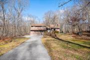 Tucked away on over 4.5 acres of serene, wooded land, this home offers a rare opportunity to retreat into a world of calm, surrounded by nature. As you make your way up the driveway, the noise of the outside world fades away, replaced by the serene embrace of the forest. Itâ€™s as though you&rsquo;ve discovered a secret escape, where quiet moments and natural beauty create the perfect backdrop for life to unfold.The moment you step inside, the home welcomes you with its warm, natural beauty. The rich hardwood floors stretch throughout, creating a sense of flow and connection in every room. The expansive living room, with its soaring cathedral ceiling and inviting fireplace, sets the stage for cozy evenings and joyful gatherings. Whether you&rsquo;re hosting a movie night or curling up with a good book, this is a space that feels both comfortable and spacious.Beyond the living room, the dining room offers an intimate space for meals and memories, with sliding glass doors that lead to a screened-in porchâ€”perfect for sipping morning coffee or watching the sun dip behind the trees at dusk. The primary bedroom, a sanctuary in itself, features its own sliding glass doors to the porch, inviting you to enjoy the fresh air at any time of day. Itâ€™s a room that offers both comfort and privacy, with a walk-in closet, a separate vanity area, and its own primary bath just waiting for your personal touch. Just off the living room, the dining area offers an ideal space for meals, celebrations, or simply enjoying a quiet evening. Sliding glass doors open onto the screened-in porch, allowing easy access to the outdoors. Itâ€™s the perfect spot for morning coffee, alfresco meals, or watching the seasons change from the comfort of home. The primary bedroom is a peaceful retreat, with its own sliding doors to the porch, walk-in closet, a separate vanity area, and a primary bathroomâ€”a private haven just waiting for your personal touch.Throughout the home, thoughtful details enhance everyday livingâ€”ample storage, well-placed closets, and a skylight that fills the space with natural light. The living room features charming built-ins, offering both functionality and character. From nearly every room, you can enjoy peaceful views of the surrounding woods, allowing nature to become part of your daily experience. This home strikes a perfect balance of spaciousness and intimacy, providing a serene retreat that feels both private and inviting.The location is a perfect blend of seclusion and convenience. Putnam Valley Elementary and Leonard Wagner Memorial Park are just a short distance away, offering easy access to outdoor recreation and activities. And when you&rsquo;re ready for a change of pace, the shops and restaurants along Route 6 are only a 10-minute drive away.This home offers more than just a place to liveâ€”itâ€™s a place where memories are made, where life slows down, and where you can enjoy every season in comfort. Surrounded by nature yet close to everything, itâ€™s the perfect spot to put down roots and build your future. Welcome to your own personal sanctuary.