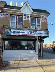 Mix-used property sold as is. Two storefront businesses. Two residential units. The full basement is unfinished.