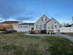 Huge Sprawling Expanded Cape, Updated Vinyl Siding, Fencing, Pergo Floors, Doors. New Bathroom, New Heating System, Hi Hats and New Pavers. Accessory Apartment for Mom!!, Additional information: Appearance:Excellent, Separate Hotwater Heater:Gas, Washer and Dryer Room, Large Shed, Updated and freshly painted wood deck.