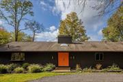 Situated on 7 acres of rolling hills and meadows, this renovated mid-century home offers privacy in a bucolic setting. The sizable entry foyer is brightened by a skylight and built-in bench. The main living room incorporates vaulted ceilings, exposed beams, a large wood-burning fireplace, and sliding doors to access the generous deck with unobstructed views. The formal dining room leads to a kitchen with stainless steel appliances and an exterior door to the pool area. Three bedrooms on the main floor include a primary suite with walk-in closet and full bathroom, two guest rooms, and a second full bathroom. The lower level offers an additional living room with fireplace, third full bathroom, two more bonus rooms, and a laundry room with storage and access to the 2-car attached garage. Outside, you will find an in-ground heated pool, a wood-burning fire pit overlooking the back meadow, and a pond shared with the adjacent property. Established short-term rental. A serene escape, yet just minutes to the Taconic State Parkway. 20 minutes to villages of Rhinebeck and Millbrook.