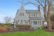 Classic charm abounds in this move-in ready Tudor/Colonial with level yard, abundant gardens all in a private setting. Truly inviting, this home has great curb appeal and is filled with warmth and original charm. Step into entry with access to powder room and notice and all new gleaming hardwood flooring in this bright and airy living room with new wood burning stove insert and cast-iron baseboards throughout. Walk through beautiful archway to formal dining room with built in shelves and lots of storage. Dining room leads to flex room which could be used for office/den/or guest bedroom with sliders to enclosed sunroom. Kitchen was renovated a few years back and is appointed with granite counters, and stainless steel appliances. The kitchen also has access to the enclosed 3 season room leading to a tastefully designed deck with outdoor brick fireplace, and beautifully landscaped stone walls and stairs up to side patio. On second floor you will find updated hall bath, with tumbled marble with extra storage, 2 bedrooms, and a primary bedroom. At the end of hallway there are stairs leading up to unheated finished room with skylights, and abundance of eave storage. Oversized driveway with side door entrance/mudroom offers convenient access to kitchen and basement. The basement is unfinished with new Navien on demand gas boiler, utilities, and laundry and plenty of room for storage. The yard is private and perfect for family gatherings. Large 2 Car Garage has 2 attached storage sheds, and a pull-down loft access. Some of the amazing updates include new roof, hardwood flooring, garage door, skylights, conversion from oil to gas, fireplace insert, new electrical 200 amp service, chimney liner, some windows replaced, and all freshly painted inside and out, including basement walls and floors. Close to all-major highways, train, buses, and stores. A must see.