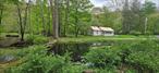 Welcome to Peekamoose Mountain Cabin nestled in the foothills of the Catskill Mountains. Just 2 hours from NYC! Set on the banks of the Rondout Creek, not far from the Rondout Reservoir this property is a haven for nature enthusiasts. Perfect for hunting, fishing, and hiking in the Catskill Forest Preserve that covers 700, 000 acers of pristine beauty. Highlighting the property&rsquo;s unique charm is a beautiful trout pond right in front of the houseâ€”a fishermanâ€™s dream come true! This home offers serene one level living with 3-bedrooms and 1 full bathroom, open kitchen and living room with a beautiful original stone fireplace. Embrace the tranquility of nature as you warm up by the woodstove after a day of outdoor adventures. Whether you&rsquo;re seeking a peaceful getaway or a base for your recreational pursuits, this Catskill Mountains retreat delivers the perfect blend of comfort and outdoor living. Come and experience the beauty of Peekamoose!