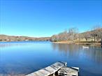 BEAUTIFUL PRIME LAND WITH LAKE ACCESS & SEASONAL LAKE VIEWS! Board of Health approved for 4 bedrooms! Discover your own piece of paradise on this 17.61 pristine acres, nestled at the end of a quiet cul-de-sac, surrounded by lush, mature trees and bordered by bubbling streams lined with vibrant forget-me-nots each spring. This breathtaking property sits atop a gentle hill, with rough cut driveway, all set and ready, all you need is a building permit, offering seasonal sweeping views of idyllic Upton Lake and the enchanting landscape that surrounds it. With access to the peaceful, 34-acre lake, itâ€™s a perfect place to kayak, fish, or simply savor natureâ€™s beauty.Imagine walking along shaded paths under a canopy of trees, listening to the soft flow of water, the bellows of bullfrogs and sweet birdsong. The atmosphere is one of pure tranquilityâ€”a rare combination of seclusion and natural beauty that invites you to rest, recharge, and reconnect. At just 1 hour & 35 minutes from New York City, this land provides an ideal escape from the urban bustle. A perfect canvas for creating a weekend retreat, a serene family estate, or a forever homeâ€”your very own piece of Eden.Whether you dream of building a cabin by the lake, setting up a hammock between the trees, or simply enjoying the peace of mind that comes with owning such an extraordinary piece of land, this property offers endless potential. Donâ€™t miss the chance to make this tranquil haven your own. What are you waiting for?