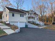 Don&rsquo;t miss this beautifully renovated and unique Colonial-style home, complete with a charming front porch, situated on over an acre of freshly landscaped property in the highly-rated Clarkstown School District. The first floor boasts a spacious living room with a wood-burning fireplace, a large dining room, and a fully updated eat-in kitchen featuring wood cabinets, granite countertops, and stainless steel appliances. You&rsquo;ll also find a versatile first-floor bedroom or den, an updated full bath, a laundry room, and an enclosed finished porch with a door leading to a patio that overlooks the expansive backyard. Upstairs, you&rsquo;ll discover three additional bedrooms, a den, and a bathroom with a shower stall. There&rsquo;s ample storage space in the basement, plus an attached two-car garage and plenty of parking in the driveway. Conveniently located near shopping, with easy access to major commuter routes, including 287, PIP, Garden State Parkway, and the TZ/Cuomo Bridge. A small pet may be allowed with additional rent.