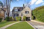 Live just steps away from everything Larchmont Village has to offer! Located on a quiet cul-de-sac, this classic Tudor with charming details and central AC has been refreshed and painted for the next occupant. The welcoming front patio leads to an entry vestibule and the wood beamed Living Room with fireplace and built-in shelving. The floor plan continues into the Dining Room and Kitchen with stainless steel appliances-both have access to the back covered porch and garden. First floor Powder Room. Up a few stairs and the staggered bedroom plan offers convenience and flexibility with two bedrooms sharing a hall bath, two additional bedrooms share en-suite bath with separate shower & tub. The upper level has a 5th bedroom with private bath & clawfoot tub. Not to be missed is the lower level space and 2-car tandem garage. Metro North Train, Turtle Park, shops, restaurants, beach and schools are all within a short walk or bike ride!