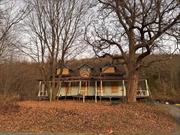 Own a whole mountain, in Amenia, on Old Route 22 between Wasaiic and Amenia. 152 +acres with views of Silo Ridge. Top of the mountain has views of Oblong valley. Driveway to one building site is in, extension to the top needed.Beautiful old House with hand hewn beams and many original details in need of restoration.Restore the house by the road and build your dream house up the driveway.Being sold in as is condition.