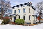 Step back in time while enjoying modern comforts in this meticulously maintained Federal-style brick home, built in the 1800s and located in the picturesque Village of Saugerties.This historic residence has been thoughtfully updated to meet contemporary needs while preserving its original charm. The main home features 4 bedrooms and 1.5 bathrooms, with a tastefully renovated kitchen that opens to a bright dining room. Original hardwood floors, tall ceilings, and period details create a warm, inviting atmosphere throughout. A lovely porch off the kitchen provides the perfect spot for morning coffee or evening relaxation. Upstairs, youâ€™ll find all four bedrooms and a full bath.An attached apartment, completely remodeled in the early 2000s, offers 2 bedrooms, 1 bathroom, private off-street parking, separate utilities, and washer/dryer hookupsâ€”ideal for extended family or rental income. The property also holds an Airbnb permit, allowing you to rent the main house, the apartment, or bothâ€”a rare opportunity as few Hudson Valley towns still allow short-term rentals. Recent updates include weatherized windows for improved energy efficiency, and both the interior and exterior have been impeccably maintained.Nestled just steps from Main Street, the home offers easy access to Saugertiesâ€™ vibrant village lifestyle: fine dining, bakeries, chocolate shops, a historic movie theater, music venues, boutique shopping, and a lively farmers market. Seasonal festivals add to the charm. Centrally located between Kingston and Woodstock and just a short drive to Rhinebeck, the home is also close to Belleayre, Hunter, and Windham Ski Resorts, the HITS equestrian center, and Cantine Field Sports & Recreation Complex with its playgrounds, fields, ice rink, and renowned 4th of July celebration.With Trailways Bus and Amtrak train services nearby, this home offers an ideal blend of historical character, modern convenience, and a prime location to experience all the Hudson Valley has to offer.Donâ€™t miss this rare chance to own a piece of Saugerties history!