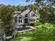 Positioned in the much-admired Smithtown school district, this stunning four-bedroom, 2.5-bathroom Colonial offers an irresistible blend of traditional charm and sleek sophistication, all set on a beautifully manicured 0.36-acre lot â€“ the perfect backdrop for your next chapter. As you approach, the grand double-door entry makes a striking first impression, hinting at the elegance that lies within. As you step inside, youâ€™ll be greeted by soaring high ceilings and the gentle glow of recessed lighting, creating a warm, inviting ambiance. Hardwood floors charmingly grace the living and dining rooms, while durable ceramic tiles extend through the updated eat-in kitchen and other living areas, ensuring beauty and functionality coexist while you live your best life. The kitchen is truly the heart of this home, offering a stylish gourmet space flaunting abundant cabinetry that promises plenty of storage while gleaming countertops and sweeping bench space provide the perfect stage for the passionate chef to take center stage. Open the sliders and let the outdoors in, revealing a true country club yard. An inground pool sparkles under the sun, surrounded by a paver patio that invites lounging and laughter, while mature trees provide natural shade, and an expansive grassy area offers the perfect spot for games of catch or summertime celebrations. Upstairs, your private sanctuary awaitsâ€”a primary suite featuring lofty ceilings, one generous walk-in closets, and an ensuite bathroom that rivals a luxury spa. With a sleek barn door and serene finishes, this space promises to be your personal retreat after a long day. Every detail in this home has been carefully curated to offer both comfort and elegance. Updated bathrooms elevate your everyday routines, while the spacious two-story layout provides ample room for family and guests alike. Located in one of the areaâ€™s most desirable neighborhoods and offering resort-style living, this Colonial is a rare gem. Nowâ€™s your chance to secure a lifestyle where convenience is at your fingertips, weekends are spent by your private pool, and every corner of your residence feels like a reflection of your dream home. Your forever begins here. Come and experience it for yourself.