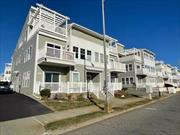 Lovely two bed two full bathroom first floor unit in the oceanfront community of Arverne by the Sea. End unit with lots of natural sunlight. Two bedrooms both have lots of closet space. Open living and dining area. Main bedroom has en-suite bathroom and unit has full sized washer/dryer. Custom flooring throughout. Central heat and air, back patio space and shared yard space. Location shops, restaurants and all transportation to Manhattan all nearby.Sorry, no pets............