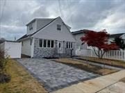 Completely remodeled expanded Cape- 5 Bed rm, 2 Bath, New Roof, New Siding , New Windows, New paver driveway w/ walkways and large rear patio. Located inside the Copiague school district. True Taxes $ 10, 654. Listed for sale by owner! Steps from the canal still safely outside the FEMA flood zone. No mandatory flood insurance needed.