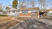 Step into luxury with this beautifully renovated 4-bedroom, 2-bathroom ranch, featuring a finished basement with OSE. Nestled in the sought-after West Babylon area, this home combines modern sophistication with convenient access to all amenities and transportation.