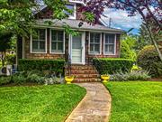 Built in 1940, this charming Craftsman-style home blends timeless character with modern updates. Boasting 3 bedrooms and 3 full bathrooms, the home retains many original features, including exquisite moldings, doors, and a pantry, adding to its classic appeal. Enjoy the enclosed front porch, perfect for relaxing, and the spacious, lazy-day back porch, ideal for outdoor living.The home is set amidst beautifully maintained English-style gardens, creating a peaceful and inviting atmosphere. Inside, you&rsquo;ll find original hardwood floors that flow throughout the main living spaces. Modern upgrades include newly renovated bathrooms, a gas heating system, stainless steel appliances, and soapstone countertops in the kitchen.Additionally, the property features a 4-car garage with a loft for extra storage or workspace, providing versatility and convenience. Located just a short walk from town and the water, this home offers the perfect combination of peaceful charm and accessibility.