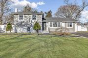 West Islip Gem! Renovated Split level home with new roof and new siding! 4 bedrooms, 3 new full bathrooms. Wood floors, recessed lighting, 200 amps, vaulted ceiling in kitchen with sliders out the new deck. New driveway. So much more! Call to see today!