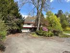 Welcome to Woodridge! Two lots for a total of 1.26 acres! Rare opportunity offers the ability to build another home for investment potential or possible family compound. This cheery, bright and airy house is spacious and perfect for a large family or mother-daughter setup. With 5 bedrooms, 3 bathrooms, 2 kitchens, and a two-car garage this one checks a lot of boxes, and is well suited for multi-generational living, extended family and plenty of room for guests. The upper level boasts 3 bedrooms, 2 full bathrooms, spacious modern kitchen, dining area and a sunlit living room with built-in bookcase. Each bedroom has ample closet space, including a walk-in closet in the primary bedroom which provides plenty of room for wardrobe and storage needs. The lower level offers a living room, 2 bedrooms, full bathroom, and small kitchen. Expansive decking overlooks Sandburg Creek and the beautiful natural surroundings. Enjoy the convenience of local shops, cafes, and dining options just a short stroll away, and a brief ride will get you to Resorts World Catskills Casino, Bethel Woods Performing Art Center, Forestburgh Playhouse, YO1 Health Resort Hotel, Holiday Mountain Ski Slopes, Kartrite Water Park, hiking trails, area lakes and all the amenities the Sullivan County Catskills has to offer. This home offers an incredible blend of space, convenience, and future potential. Whether youâ€™re looking for a large home for your growing family, a place to entertain guests or a property with investment opportunities, this is the one youâ€™ve been waiting for!