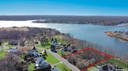 Once in a lifetime opportunity to own New Construction Waterfront. 2, 891 Square foot custom Colonial in Windmere Point development features breathtaking unobstructed water view and access of Forge River leading out to Moriches Bay. This homes sits towards the back of the cul-de-sac on an incredible 1.02 acre lot with 155.7 feet of waterfront. Custom design Center Hall Colonial with Royal Portsmouth cedar impression shake siding with White Azek exterior trim & partial stone front facade, Prestige double hung Anderson windows, 30 year architectural solar ready roof, carriage style garage doors or similar with Genie Wi-Fi garage door opener & covered front porch portico. Grand two-story entry, hardwood floors, recessed lighting, custom molding, 9 foot first floor ceiling, two panel shake interior doors. Chef&rsquo;s kitchen with Stainless steel appliances, Shaker-style cabinetry, 42 upper cabinets. Quartz kitchen countertops (1.25 thickness), Stainless Steel Sink. 36 gas stove, Center Island with additional seating. Just off the kitchen access to Mud Room, Pantry, Powder Room & Garage. Open floor plan to Great Room with 42 Gas Fireplace. Formal dining room & Formal Living Room complete the first floor. The 2nd floor features an Enormous primary suite with walk-in closet, spa-like primary bath with double sink and shower, three additional spacious bedrooms all with 8&rsquo; closets, hallway bath double sinks. Laundry Room with GE or similar Top-Load Washer/Dryer. Full basement with 8 foot ceilings. Forced hot air Propane gas heat. 2 unit CAC. 50 gallon gas, hot water heater. 2-car garage. Still time to customize Homeowners may be able to choose custom finishes, and upgrade prior to completion. Conveniently located to the Hamptons, North Fork and just 60 minutes to Midtown Manhattan. Home is being featured by award winning Kelly Development, with over 30 years of diversified Real Estate industry experience, and has been involved in the development of over 2, 000 homes on Long Island. White-glove service includes fully turnkey construction, pre-move-in cleaning with quality assurance with Home Warranty & final walkthrough inspection and new home orientation pre-closing.