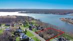 Once in a lifetime opportunity to own New Construction Waterfront. 2, 891 Square foot custom Colonial in Windmere Point development features breathtaking unobstructed water view and access of Forge River leading out to Moriches Bay. This homes sits towards the back of the cul-de-sac on an incredible 1.02 acre lot with 155.7 feet of waterfront. Custom design Center Hall Colonial with Royal Portsmouth cedar impression shake siding with White Azek exterior trim & partial stone front facade, Prestige double hung Anderson windows, 30 year architectural solar ready roof, carriage style garage doors or similar with Genie Wi-Fi garage door opener & covered front porch portico. Grand two-story entry, hardwood floors, recessed lighting, custom molding, 9 foot first floor ceiling, two panel shake interior doors. Chef&rsquo;s kitchen with Stainless steel appliances, Shaker-style cabinetry, 42 upper cabinets. Quartz kitchen countertops (1.25 thickness), Stainless Steel Sink. 36 gas stove, Center Island with additional seating. Just off the kitchen access to Mud Room, Pantry, Powder Room & Garage. Open floor plan to Great Room with 42 Gas Fireplace. Formal dining room & Formal Living Room complete the first floor. The 2nd floor features an Enormous primary suite with walk-in closet, spa-like primary bath with double sink and shower, three additional spacious bedrooms all with 8&rsquo; closets, hallway bath double sinks. Laundry Room with GE or similar Top-Load Washer/Dryer. Full basement with 8 foot ceilings. Forced hot air Propane gas heat. 2 unit CAC. 50 gallon gas, hot water heater. 2-car garage. Still time to customize Homeowners may be able to choose custom finishes, and upgrade prior to completion. Conveniently located to the Hamptons, North Fork and just 60 minutes to Midtown Manhattan. Home is being featured by award winning Kelly Development, with over 30 years of diversified Real Estate industry experience, and has been involved in the development of over 2, 000 homes on Long Island. White-glove service includes fully turnkey construction, pre-move-in cleaning with quality assurance with Home Warranty & final walkthrough inspection and new home orientation pre-closing.