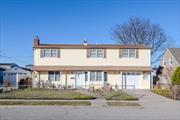 Move right into this impeccably maintained 6-bedroom, 2-bathroom Colonial home in Levittown, offering 2, 400 square feet of open living space. The first floor showcases a modern eat-in kitchen with Quartz countertops, a cozy living room with a wood-burning fireplace, a formal dining room, a den that opens to the private backyard through sliding doors, and a convenient small bedroom for guests or family members. Additional features include a natural gas burner, stove, and a dedicated hot water tank, along with 150 Amp service. Upstairs, the second floor boasts 5 spacious bedrooms and a full bathroom. Enjoy the convenience of a one-and-a-half-car garage with an automatic opener and interior access, ideal for rainy days. A covered patio provides a perfect spot to relax on hot sunny days.