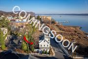 This one of a kind Nyack space is located just steps from the Hudson river and has panoramic river views which include both the Bridge and Hook Mountain. Only one block from downtown, this light filled space can serve as a special place for your business or for your business plus your home or a rental apartment. You decide. Zoned DMU 2 you have options and the possibility to expand even more. Airy and open with a 2 story entry and South East exposures plus beautiful hardwood floors this property offers an open concept floor plan that can be tailored to your needs. Yoga, gym, spa, attorney or accountant office or even a dog grooming spa are all great possibilities within these 3 floors. 2 1/2 baths, great basement storage plus 5 off street parking spots. Generac full house generator.