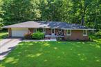 Fabulous Mid Century Modern Brick Ranch located in Sparrowbush NY is only minutes to commuter trains and buses, the Delaware River for recreation, Port Jervis shops, schools and conveniences. Enter this lovely home through a spacious foyer and into a large living room with brick fireplace and natural wood floors, The living room has a serene comfortable feeling with a mid century modern flare. A separate dining room leads into a large galley style kitchen where all your home cooked meals can be made! From the kitchen you can enter an enormous laundry room, perfect to storage, crafts and very comfortable to do your laundry. 3 lovely bedrooms, including a huge primary bedroom with double closets and on suite bathroom. Hardwood floors throughout, attached, 2 car garage and a full open basement for future storage, imagine a rec room and or dream of your exercise room, man cave or she shed.  Outside you have a lovely grassed front yard and in the rear your have a large patio to entertain your family and guests. Well maintained inside and out! All of this only 90 minutes GWB! Come view your dream home today!