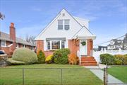 Legal Two-Family Brick Home on Oversized LotLocated on a 50 x 100 corner lot, this legal two-family home is steps from Crocheron Park and walking distance to Bell Blvdâ€™s shops, dining, and Bayside LIRR. The first floor features 3 bedrooms, while the second floor offers 2 bedrooms. Includes a private driveway and two-car garage. Endless potential to update and make it your own in this prime location!