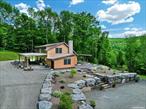 Escape to your own 61-acre private retreat, accessed via a private bridge leading to a custom-built contemporary home. This 3-bedroom, 2-bath sanctuary features an open floor plan, a chef&rsquo;s kitchen with concrete countertops, and Jenn-Air stainless steel appliances. The living area boasts cathedral ceilings, a bluestone hearth fireplace, and a striking modern staircase. A heated full basement with its own fireplace offers versatile living space. Outside, enjoy a wrap-around patio and a spacious 3+ car garage with water and electricity. Explore trails, caves, wildlife, and hunting stands, all just 2.5 hours from NYC, near Delhi, Oneonta, and Cooperstown., Additional information: Appearance:Diamond