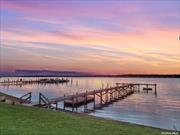 **Charming 2nd Floor Waterfront Pied-a-Terre** Discover your dream retreat in the heart of Hampton Bays with this exquisite waterfront pied-a-terre. Nestled along the serene shores of Rampasture Road, this charming residence offers breathtaking sunset views that paint the sky with hues of orange and pink every evening. Step inside to find a cozy yet elegant living space, perfect for a tranquil getaway. Embrace the waterfront lifestyle with direct access to clamming and boating right from your doorstep. Whether you&rsquo;re an avid sailor or simply enjoy a leisurely day on the water, this location offers endless opportunities for aquatic adventures. Outside, a private deck provides the perfect spot to unwind and soak in the natural beauty of the bay. Enjoy your morning coffee or evening glass of wine while watching the boats drift by and the sun dip below the horizon. Located just minutes from the vibrant community of Hampton Bays, you&rsquo;ll have easy access to local dining, shopping, and entertainment options, all while enjoying the peace and privacy of your own waterfront oasis. Don&rsquo;t miss this rare opportunity to own a slice of paradise in one of the most sought-after locations on the East End. Experience the ultimate in coastal living at 46 Rampasture Road #5. Schedule your private showing today! EASY LIVING. Don&rsquo;t worry think about it in the winter and everything is taken care of in the summer! Open 6 months of the year. HOA of $615/ month includes taxes, water, cable, garbage, lawn, snow removal, irrigation, property insurance