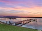 **Charming 2nd Floor Waterfront Pied-a-Terre** Discover your dream retreat in the heart of Hampton Bays with this exquisite waterfront pied-a-terre. Nestled along the serene shores of Rampasture Road, this charming residence offers breathtaking sunset views that paint the sky with hues of orange and pink every evening. Step inside to find a cozy yet elegant living space, perfect for a tranquil getaway. Embrace the waterfront lifestyle with direct access to clamming and boating right from your doorstep. Whether you&rsquo;re an avid sailor or simply enjoy a leisurely day on the water, this location offers endless opportunities for aquatic adventures. Outside, a private deck provides the perfect spot to unwind and soak in the natural beauty of the bay. Enjoy your morning coffee or evening glass of wine while watching the boats drift by and the sun dip below the horizon. Located just minutes from the vibrant community of Hampton Bays, you&rsquo;ll have easy access to local dining, shopping, and entertainment options, all while enjoying the peace and privacy of your own waterfront oasis. Don&rsquo;t miss this rare opportunity to own a slice of paradise in one of the most sought-after locations on the East End. Experience the ultimate in coastal living at 46 Rampasture Road #5. Schedule your private showing today! EASY LIVING. Don&rsquo;t worry think about it in the winter and everything is taken care of in the summer! Open 6 months of the year. HOA of $615/ month includes taxes, water, cable, garbage, lawn, snow removal, irrigation, property insurance