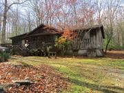 Built in 1972 this 3 bedroom, 2 bath ranch is located in a peaceful setting in the country. Finkle Rd is a rural Rd that ends at a 197 acre conservation property.This home offers surprisingly more space than appears, it has 1560 sq ft. The rustic, yet charming interior features vaulted ceiling, exposed beams, knotty pine wainscoting, wood floors including hardwood plank and pegged flooring in the living room, along with a woodstove that seals that homey look and feel.There are 2 sets of sliders one that leads to the back yard and the other to the front porch. Kitchen offers plenty of wood cabinets and useful counter space, stainless steel dishwasher and range, ceramic tile floors. Formal Dining room extends that charm. The master suite is large and also has vaulted ceilings. The master bath has a jetted tub and a large walk-in closet. The other 2 bedrooms offer comfortable space and a 2nd bath serves that area. This property is forchilling out... taking away life&rsquo;s stresses .... relaxing on the porch with your favorite libation, fire up your grill and enjoy your .87 acre wooded oasis. 2 vehicle carport, 2 sheds and a circular drive complete the scene. Let the area be your venue for life. Enjoy close attractions and easy commute from Route 209 to many of the gems that our area offers.  has an accepted offer on it ,