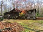 Built in 1972 this 3 bedroom, 2 bath ranch is located in a peaceful setting in the country. Finkle Rd is a rural Rd that ends at a 197 acre conservation property.This home offers surprisingly more space than appears, it has 1560 sq ft. The rustic, yet charming interior features vaulted ceiling, exposed beams, knotty pine wainscoting, wood floors including hardwood plank and pegged flooring in the living room, along with a woodstove that seals that homey look and feel.There are 2 sets of sliders one that leads to the back yard and the other to the front porch. Kitchen offers plenty of wood cabinets and useful counter space, stainless steel dishwasher and range, ceramic tile floors. Formal Dining room extends that charm. The master suite is large and also has vaulted ceilings. The master bath has a jetted tub and a large walk-in closet. The other 2 bedrooms offer comfortable space and a 2nd bath serves that area. This property is forchilling out... taking away life&rsquo;s stresses .... relaxing on the porch with your favorite libation, fire up your grill and enjoy your .87 acre wooded oasis. 2 vehicle carport, 2 sheds and a circular drive complete the scene. Let the area be your venue for life. Enjoy close attractions and easy commute from Route 209 to many of the gems that our area offers.  fully available.