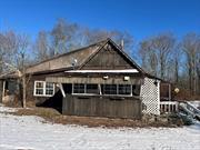 Seclusion awaits you in this bird watcher&rsquo;s paradise.  Feel like you&rsquo;re miles away from everything but only a short trip to the town center.  Great weekend getaway! Cottage with balcony overlooking huge living room. Several outbuildings, barns, garages, etc.  Over 10 acres of privacy!  SUV is recommended to access - long and curvy driveway through the woods (currently snow covered) to the house. Sold as-is. Buyer to pay NYS and any local transfer taxes. Cash offers only with proof of funds. **Please see agent remarks for access, showing instructions and offer presentation remarks.**