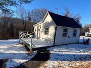 Studio cottage located on 10 acres to enjoy being secluded! This cottage features open space as well as your own little deck. Landlord pays for electricity & water. Tenant to provide their own AC & pets will be considered!