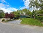 Nestled in the sought-after Wildwood Lake Development in Southampton Town, this charming raised ranch is ready for its new owners! The main level features a bright, spacious living room with a fireplace, an efficient kitchen with an island, and an adjacent dining area, creating a seamless flow for everyday living and entertaining. Down the hallway are three generously sized bedrooms and a full bathroom.The lower level offers incredible versatility with a large living space, a kitchenette, a fourth bedroom, and an additional full bathroom, complete with outdoor access. This layout is ideal for rental income or extended family and guests. Outside, the property offers a nicely sized front yard, carport, driveway, and extra parking. The backyard is a blank canvas, ready to be transformed into your private retreat. This home combines comfort, functionality, and an excellent location, presenting an amazing opportunity for homeowners and investors alike. Donâ€™t miss out! **SOLD AS IS**