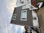 Charming 3-bedroom, 1-bathroom 2 story home in New Dorp Beach. This home, built in 1943, features a newly renovated kitchen with stainless steel appliances, new vinyl siding, flashing, and gutters. Transferable solar panel system with warranty from SUNRUN will be sure to please your pocketbook. Enjoy a small yard and driveway parking for three cars. Kitchen is in basement and is bonus square footage. Located near Gateway National Recreation Area and just a short walk to the beach.