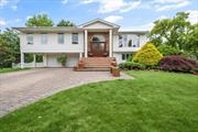 8 Peppermint Rd in the heart of Commack w/in the famed Candy section offers a 3222 sq ft Hi Ranch home boasts 4 spacious br&rsquo;s & 3 full baths w/ professional landscaping on a shy 1/2 acre. The paver driveway & double-door entry set the tone for the elegance w/in. Step inside to gleaming hw floors & soaring vaulted ceilings, complemented by skylights & large windows that fill the space w/ natural light. The bright kitchen is a chef&rsquo;s delight, w/ granite countertops, SS Appl&rsquo;s, w/ white cabinetry. It flows seamlessly into the living rm, dining rm, & a generously sized octagonal great rm w/ vaulted ceiling. 8 ft French doors off the great rm lead to a 550sq. ft.Trex deck for outdoor entertaining. The lower level is equally impressive w/ versatile space for a den/playroom/home gym, or a possible mother-daughter w/ proper permits. The expanded br&rsquo;s w/ floor-to-ceiling windows/tray/cathedral ceilings/huge closets, provide a serene retreat. The modern design is stylish & welcoming, making every rm feel special. Add&rsquo;l features include updated electrical systems/custom doors/new roof/chimney/siding/custom high end bathrooms/heating/central air conditioning. This stunning home is ready to welcome its new owners.