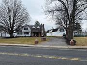 completely renovated colonial with many features primary family home for fifty years, OFFER An ADDITIONAL BUILDING COMMERICAL INCOME WITH 4 STUDIOS APARTMENTS AND RETAIL BEAUTY SALON AND NON-WORKING CAR WASH OR EXPANDABLE SPACE SEE COMMERICAL LISTING