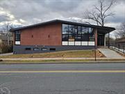 One of the most exciting projects in the Village of Warwick, this classic contemporary style office building circa 1968 is currently undergoing major interior renovations, the office space of the 70â€™s has been stripped away and an open floor plan with high ceilings has emerged. Central Business (CB) zoning permitted use allows for museums, art galleries, professional offices, banks, retail, personal service, eating drinking establishments, conditional uses include churches, nursery school/day care. Two levels, interior staircase, new windows, newer roof. Upper level accessible from entrance/ramp in front and side entrance, lower level accessible via side entrance. Several parking spaces come with the space, additional parking spaces to be negotiated based on the proposed use. This is a great building in a superb location with huge potential for the right user and an incredible opportunity. A savvy business owner with creative vision will see the benefit of launching their dream business from this open canvas.