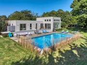 Bright and spacious Contemporary summer rental on the North Fork. Featuring floor to ceiling windows, great room, 6 bedrooms, 3.5 bathrooms, eat-in kitchen, recreation room. Privat back yard with 40x20 salt water heated pool. Offered June 1 - 28 $25, 000; June 29 - July 18 $33, 000; July (2 weeks) $24, 000; July 26 - Aug 2 $14, 000; Sept 4 - Oct 2 $30, 000. Permit #1230.