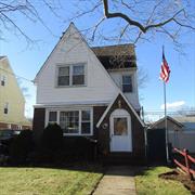 Welcome to this sunny, spacious Tudor, on a quiet tree lined block. Features include a large living room, foyer, modern eat in kitchen, formal dining room with sliding door to the private, fenced backyard, a large Master bedroom plus two additional good sized bedrooms. There is a huge open floor plan finished walk up attic, and full finished basement. There is a full bath and a half-bathAfter a bit of TLC, this home presents and opportunity for customization to make it your own! Close to ground transportation, major highways, easy shopping and excellent restaurants. In school district #26.