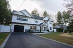 Welcome home! This 5 Bedroom 5 Bathroom Colonial exudes character from the moment you walk through the front door. 1st floor bedroom is perfect for guests with own separate full bathroom. Get cozy in the open concept living room featuring a fireplace. Brand new Trex deck is a great addition perfect for year-round enjoyment. This house features two master bedrooms, each with its own separate bathroom. The primary Master bedroom features a double walk-in closet and a Master bath with jacuzzi. Finishes on this house are the definition of elegance. All 2nd floor bathrooms feature heated floors. The vibrant brand-new espresso hardwood floors are both beautiful and durable. Location is IDEAL with a less than 5-minute drive from downtown Huntington. Plenty of fine dining and entertainment is a skip away. The charming Heckscher park in the heart of Huntington is a 2-minute drive away. This location affords you walking distance to the best Huntington has to offer.