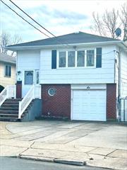 Welcome Home to this Beautiful Hi Ranch nestled in the heart of Valley Stream, walk to the park, LIRR, shopping, 1 car attached garage with additional parking. Gleaming hardwood floors throughout, stainless steel appliances, large bedrooms, first floor bath, sliders on first floor bring you out to a concrete patio and landscaped private yard.